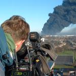 BBC Cameraman on top of Cherry picker outside the Village Hall.